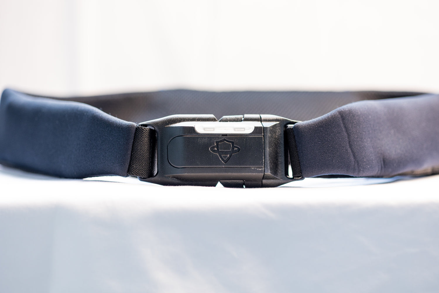 Close up of a black Smart Hip Guardian belt, on a simple white background.